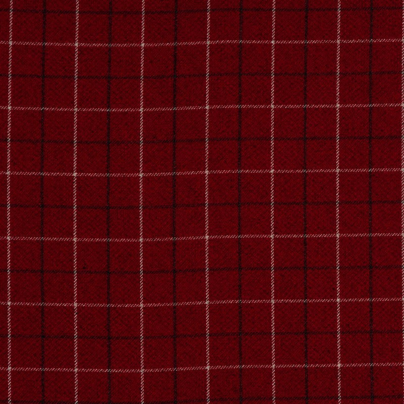 Handmade red tartan cushion with the word “Cwtch” in wool-felt appliqué, crafted in Wales.