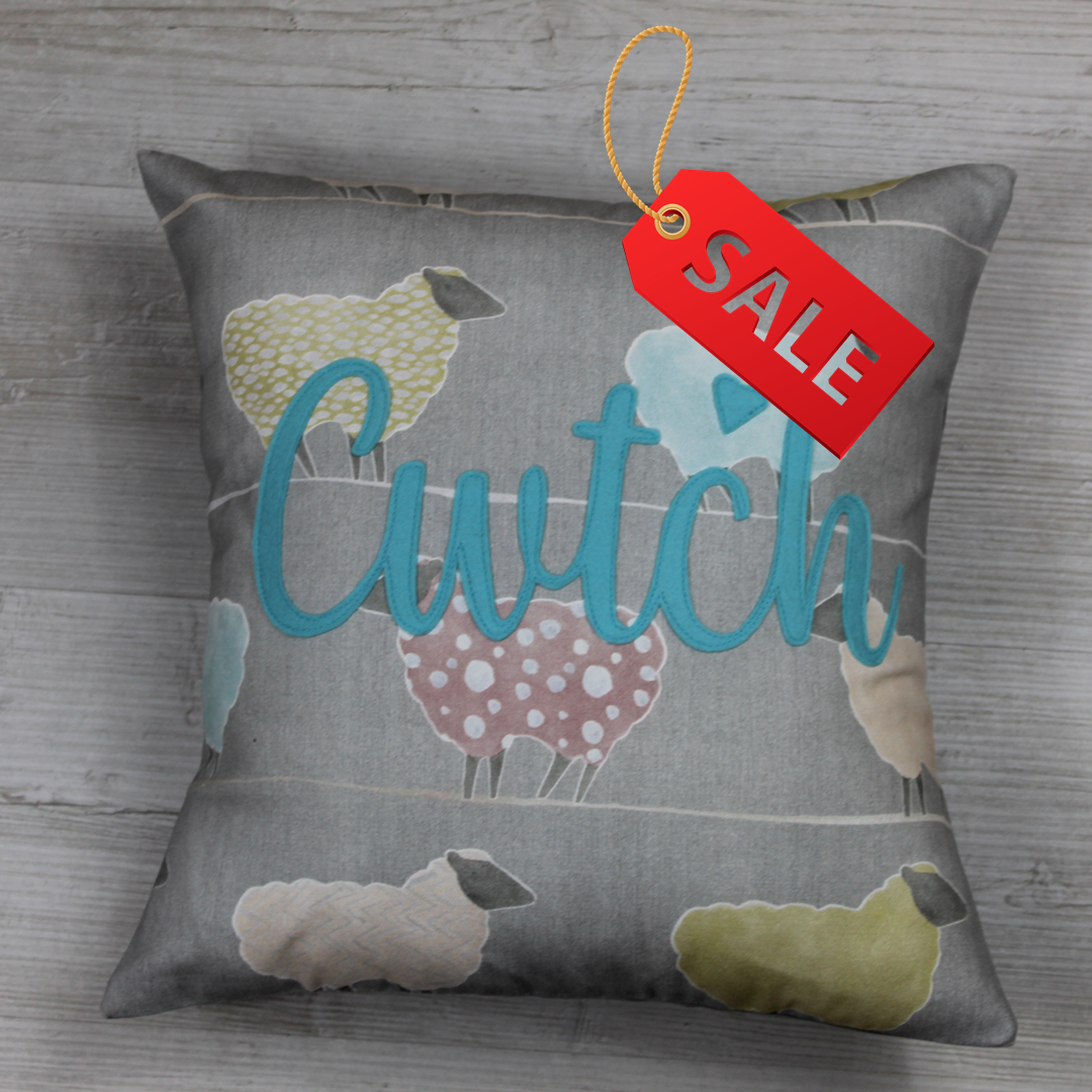 Handmade Welsh ‘Cwtch’ cushion made from 100% cotton sheep-pattern fabric