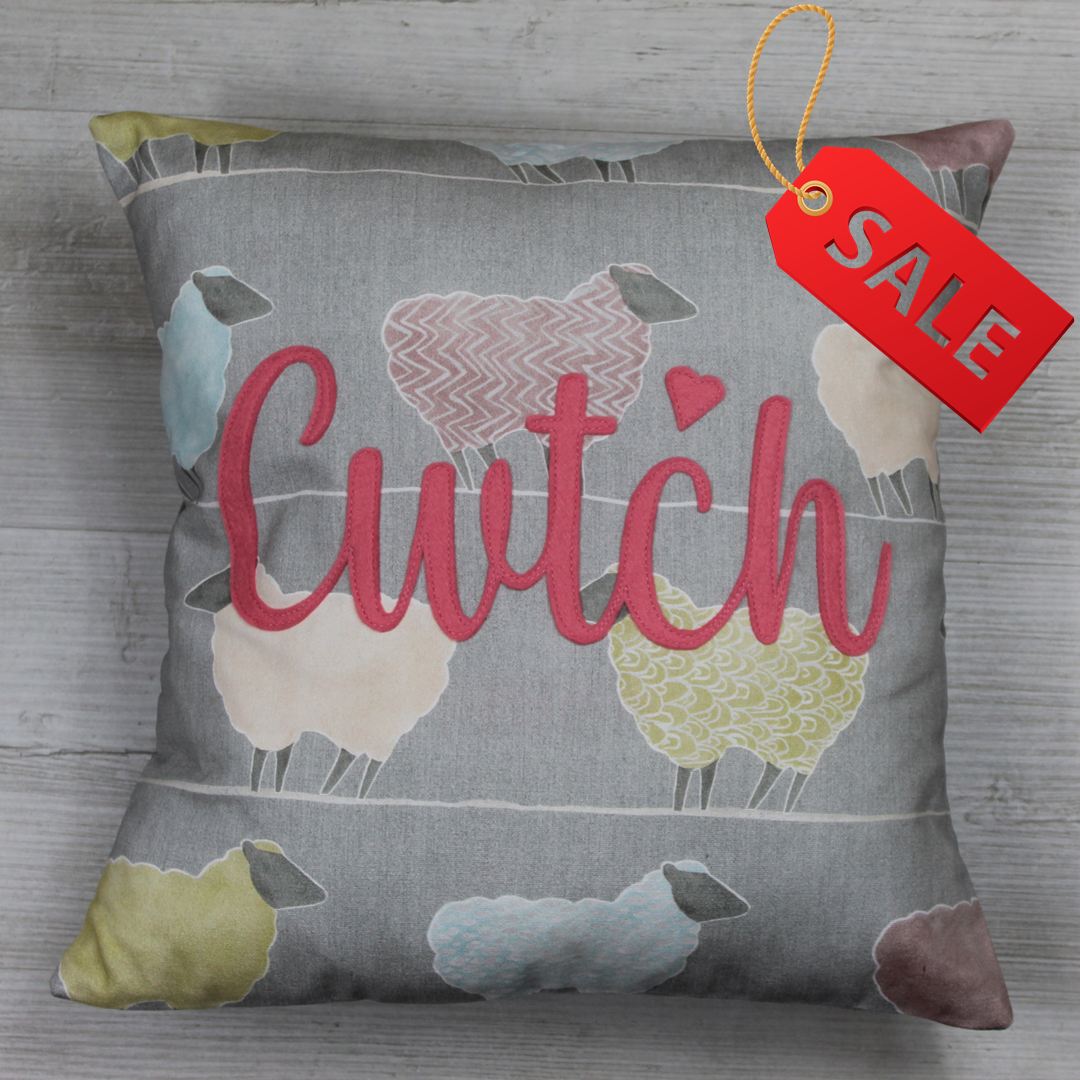 Handmade Welsh ‘Cwtch’ cushion made from 100% cotton sheep-pattern fabric