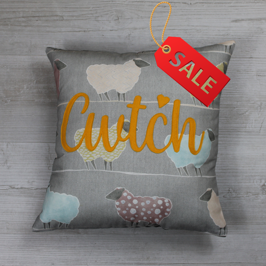 Handmade Welsh ‘Cwtch’ cushion made from 100% cotton sheep-pattern fabric